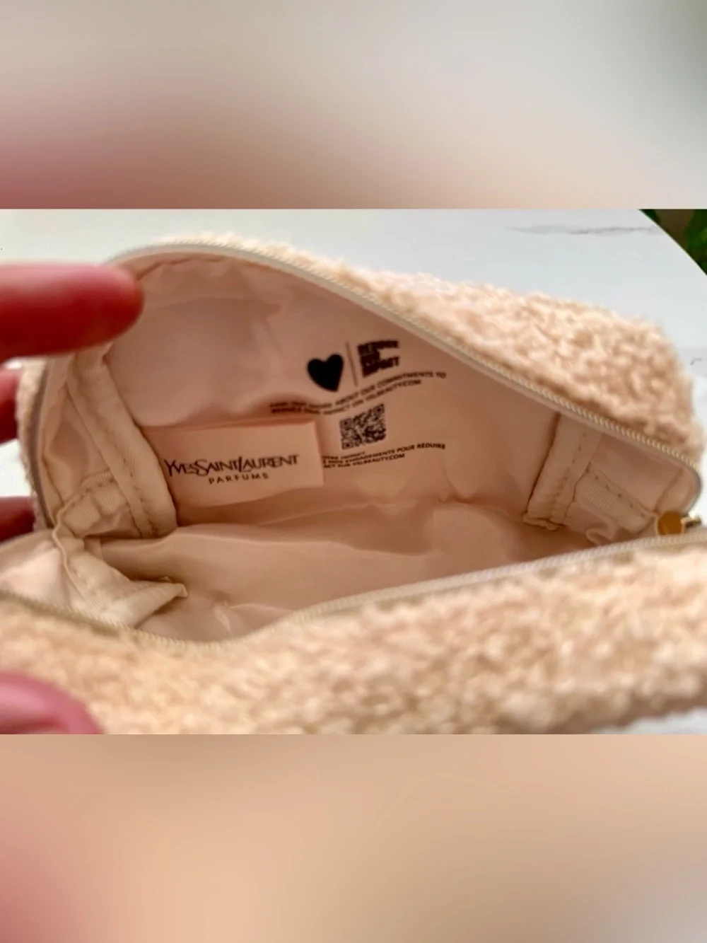 Yves Saint Laurent beaute Cream shearling pouch with gold hardware